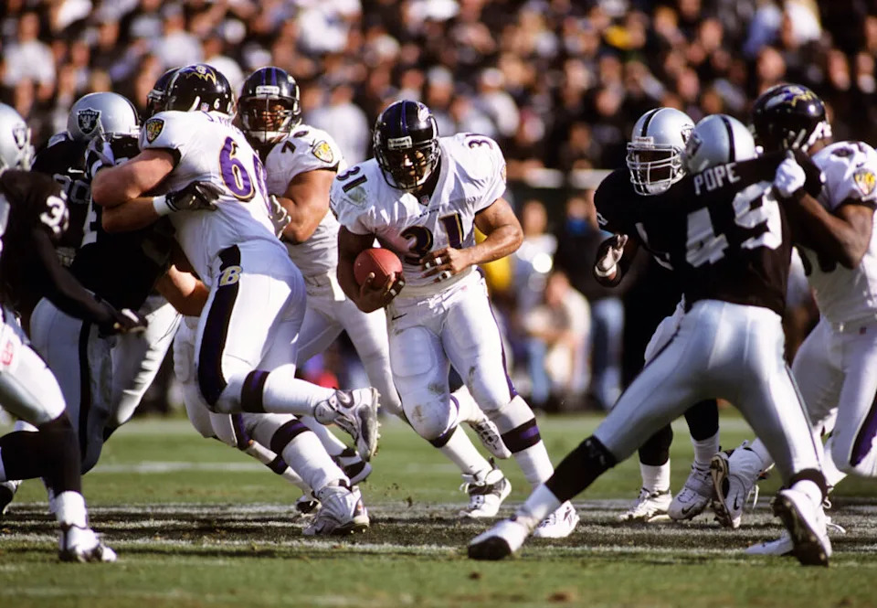 Jan 14, 2001; Oakland, CA, USA; FILE PHOTO; Baltimore Ravens running back Jamal Lewis (31) in action against Oakland Raiders defensive back Marquez Pope (49) during the 2000-01 AFC Championship game at Oakland Alameda Coliseum. Mandatory Credit: Peter Brouillet-USA TODAY NETWORK