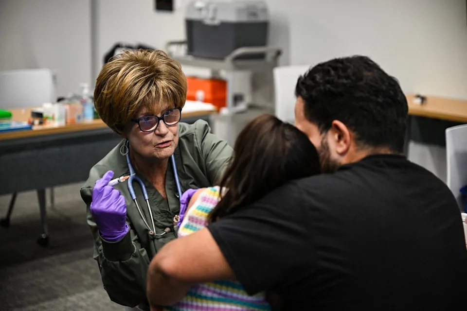 A member of a medical staff administers a dose of the measles vaccine to a child at a health center in Lubbock, Texas, in February 2025. The U.S. is seeing its worst outbreak of the vaccine-preventable virus in over three decades (AFP via Getty Images)