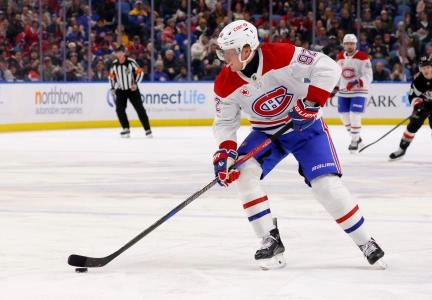 Mar 1, 2025; Buffalo, New York, USA; Montreal Canadiens right wing Patrik Laine (92) looks to take a shot on goal during the first period against the Buffalo Sabres at KeyBank Center. Mandatory Credit: Timothy T. Ludwig-Imagn Images