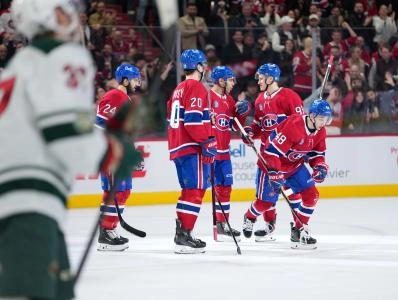 Jan 20, 2026; Montreal, Quebec, CAN; Montreal Canadiens defenseman Lane Hutson (48) celebrates with teammates after scoring a goal against the Minnesota Wild during the second period at the Bell Centre. Mandatory Credit: Eric Bolte-Imagn Images