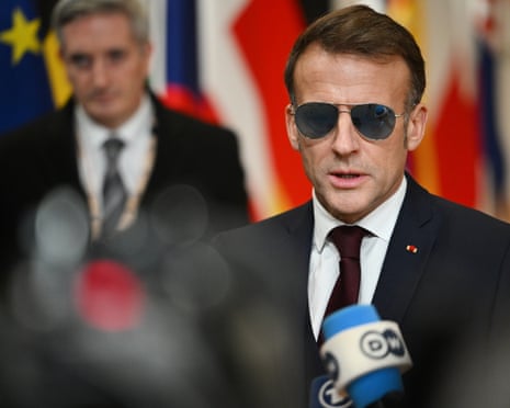 French president Emmanuel Macron speaks with the media as he arrives for the EU summit in Brussels.