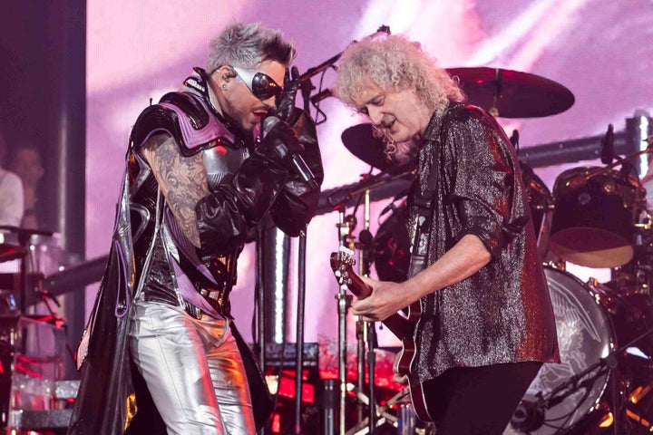 Queen's lead guitarist Brian May, right, performs with Adam Lambert in 2023. 