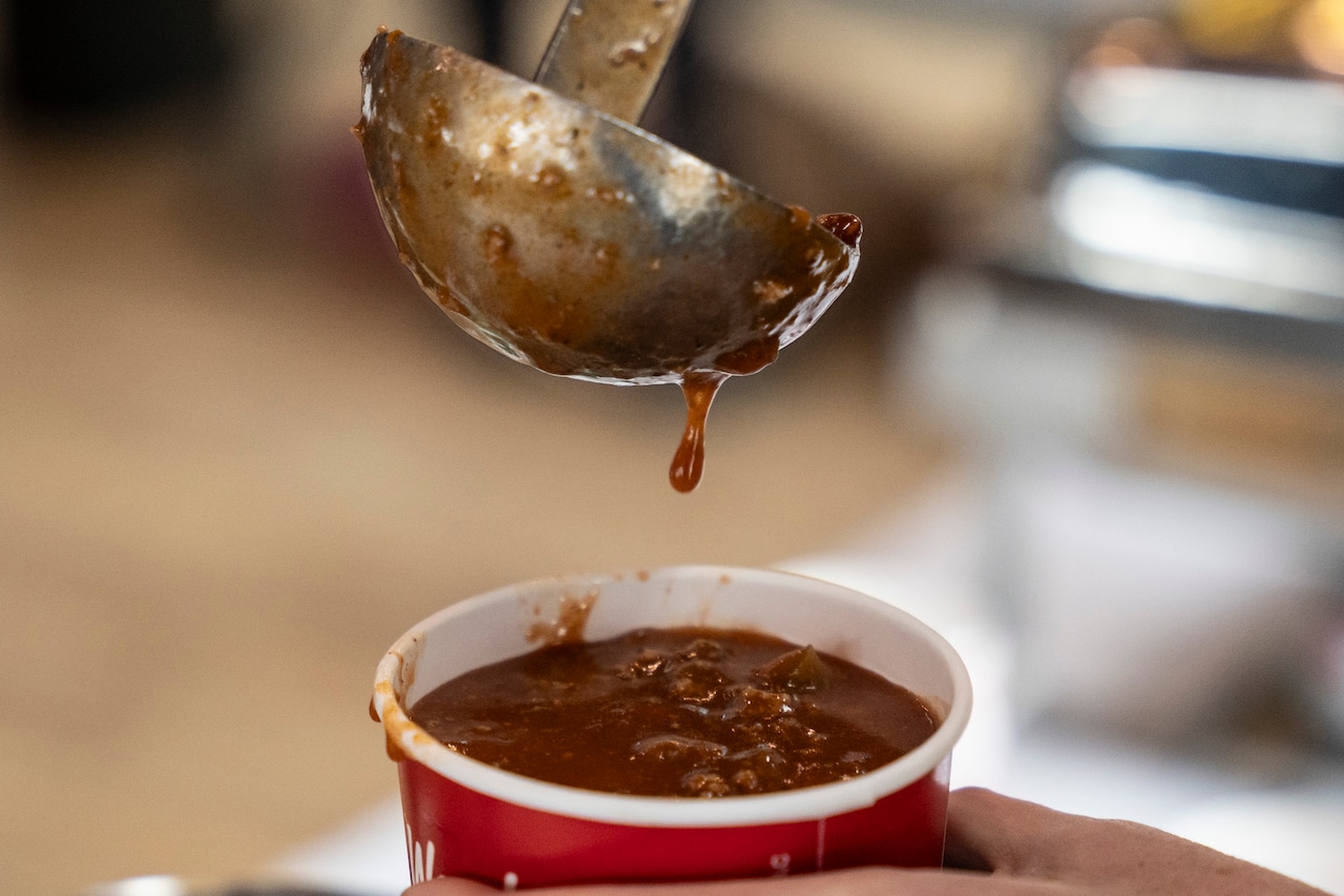 Golfers play through the snow at the annual Kiwanis Chili Golf Classic
