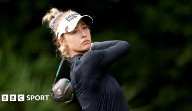 Nelly Korda looks down the course at the end of the follow-through from a shot