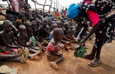 Reuters Children receiving aid in Sudan