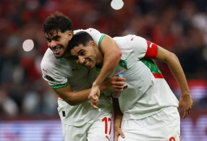 Morocco's Achraf Hakimi and Morocco's Abde Ezzalzouli celebrate after the match
