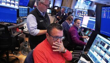 Wall Street pulls back from its records as JPMorgan Chase and Delta kick off earnings season