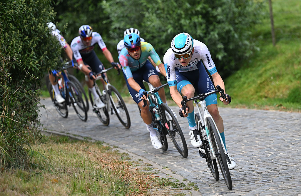 Matej Mohorič leads the bunch in a 2025 race