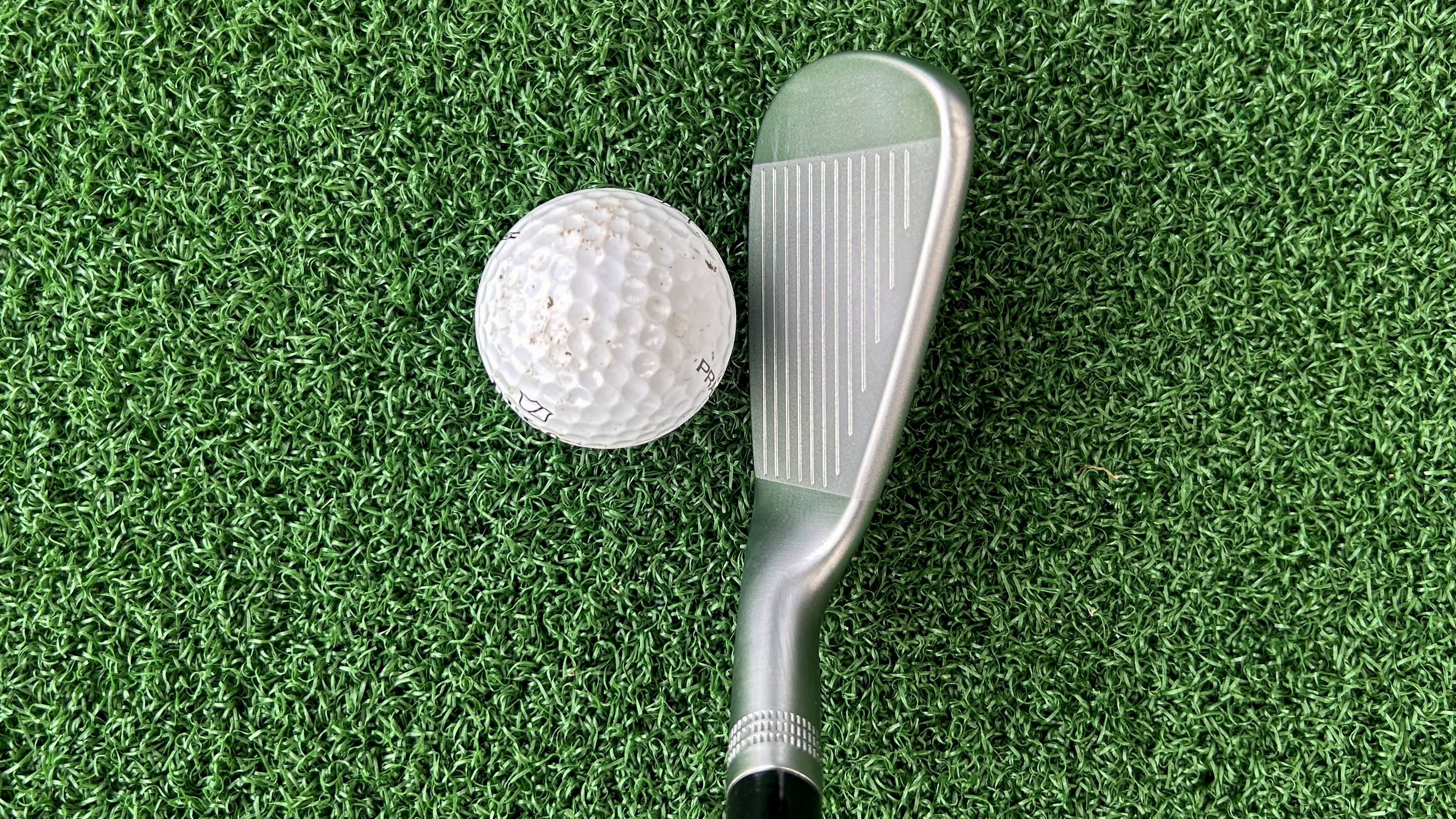 Photo of the Wilson 2026 Staff Model CB Iron behind the ball