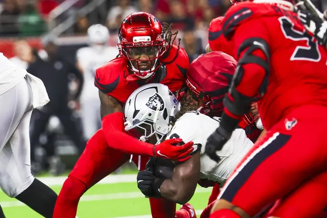 Dec 21, 2025; Houston, Texas, USA; Houston Texans safety Calen Bullock (2) tackles Las Vegas Raiders running back Ashton Jeanty (2) during the third quarter at NRG Stadium.