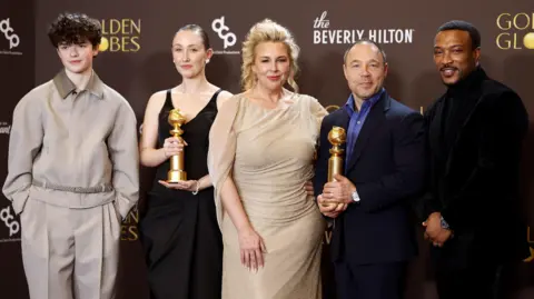 CHRIS TORRES/EPA/Shutterstock Owen Cooper, Erin Doherty, Hannah Walters, Stephen Graham and Ashley Walters pose with the Golden Globe Awards after winning the Best Television Limited Series, Anthology Series, or Motion Picture Made for Television award for Adolescence