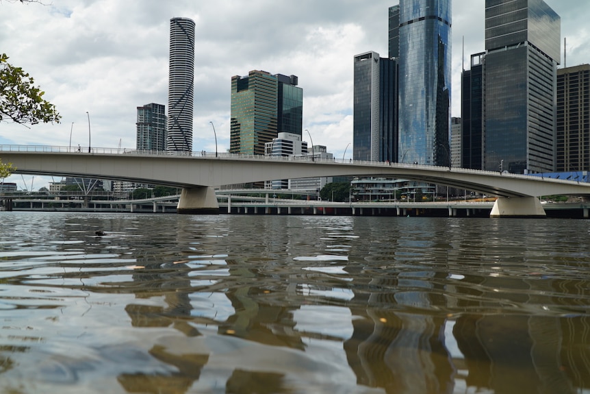 Brisbane River from water level with North Quay and Victoria Bridge in shot