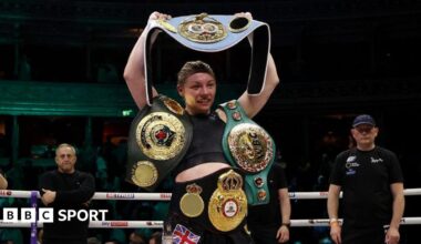 Lauren Price poses with her world titles after beating Natasha Jonas