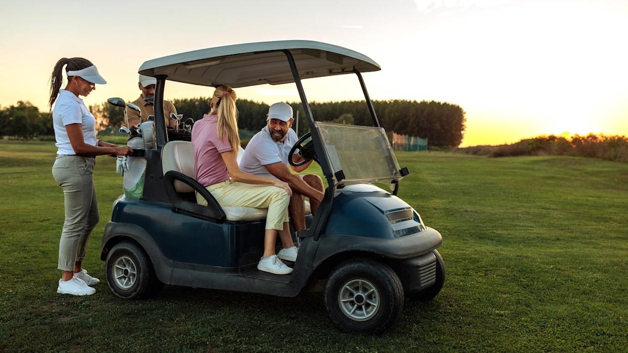 People in golf cart