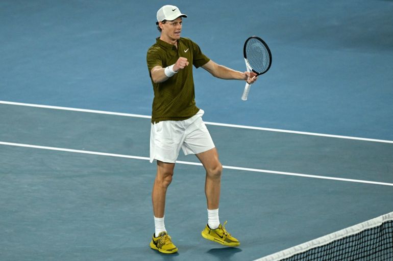 Italy's Jannik Sinner celebrates after winning against USA's Ben Shelton during their men's singles quarter-final match on day eleven of the Australian Open tennis tournament in Melbourne on January 28, 2026. (Photo by WILLIAM WEST / AFP) / -- IMAGE RESTRICTED TO EDITORIAL USE - STRICTLY NO COMMERCIAL USE --
