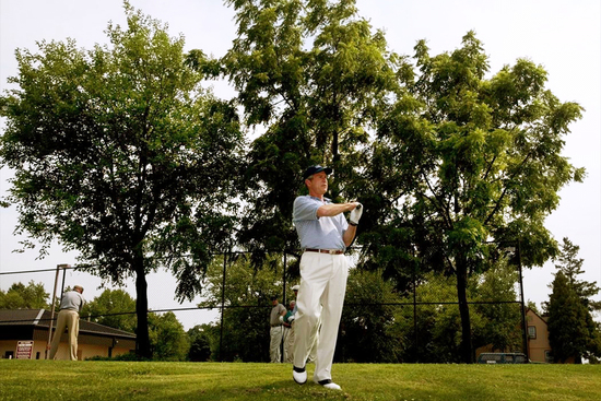 FILE - President George W. Bush practices his swing as he prepares to tee off on the first hole at the golf course at Andrews Air Force Base, Md., July 3, 2002. (AP Photo/Pablo Martinez Monsivais, File)