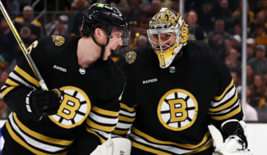 Jeremy Swayman Mason Lohrei skating for the Boston Bruins