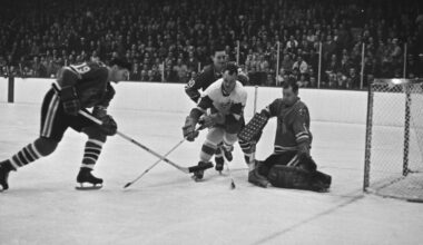Detroit Red Wings' star Gordie Howe (9) charges in but is ganged up on the three Chicago players, Al MacNeil (19), Doug Jarrett (20), and goalie Glenn Hall, who defend against the shot in first period of their NHL game in Chicago, March 16, 1966.  (AP Photo/Paul Cannon)