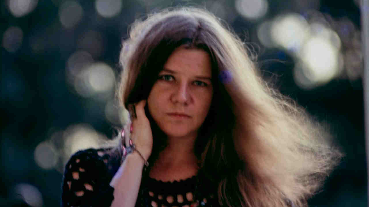 Janis Joplin posing for a photograph in the late 1960s