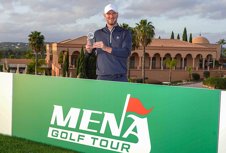 Chris Wood poses with the trophy MENA Golf Tour