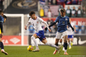 A soccer player dribbles the ball. (© Erick W. Rasco/Sports Illustrated/Getty Images)