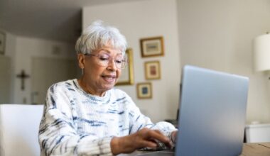 Senior uses a laptop computer