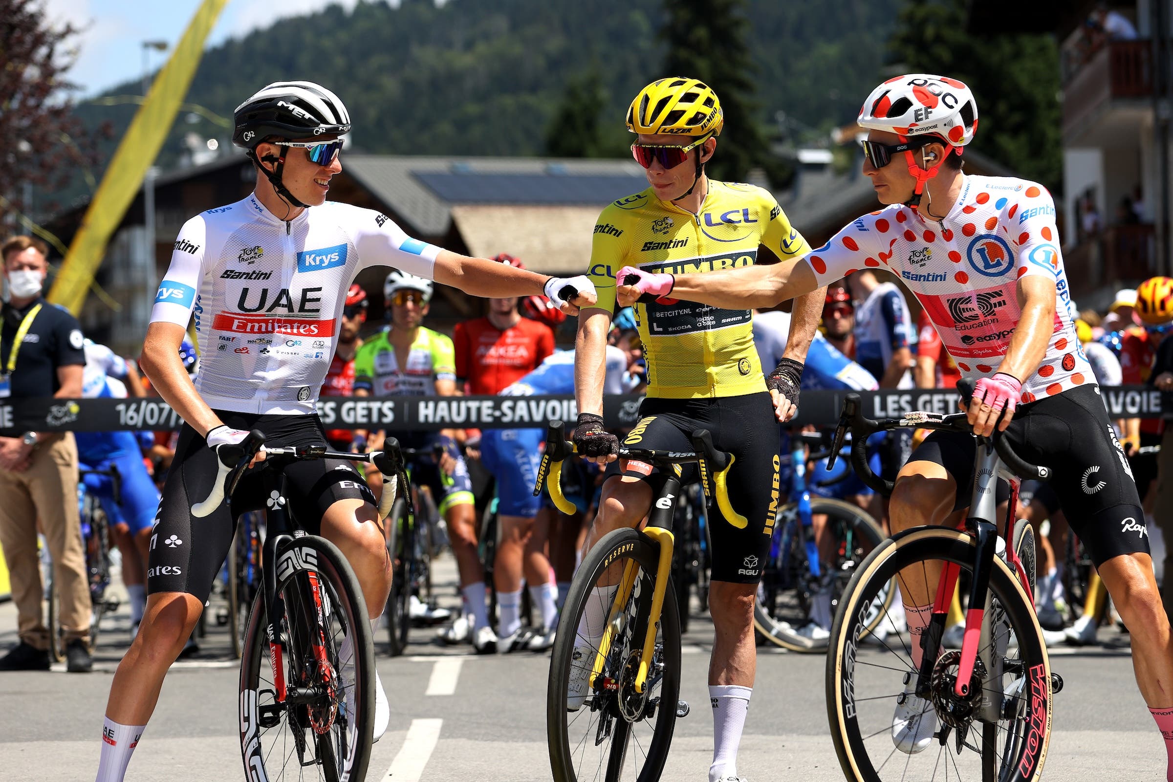 (L-R) Tadej Pogacar of Slovenia and UAE Team Emirates - White Best Young Rider Jersey, Jonas Vingegaard of Denmark and Team Jumbo-Visma - Yellow Leader Jersey and Neilson Powless of The United States and Team EF Education-EasyPost - Polka Dot Mountain Jersey prior to the stage fifteen of the 110th Tour de France 2023 a 179km stage from Les Gets les Portes du Soleil to Saint-Gervais Mont-Blanc 1379m / #UCIWT / on July 16, 2023 in Les Gets les Portes du Soleil, France. (Photo: Michael Steele/Getty Images)