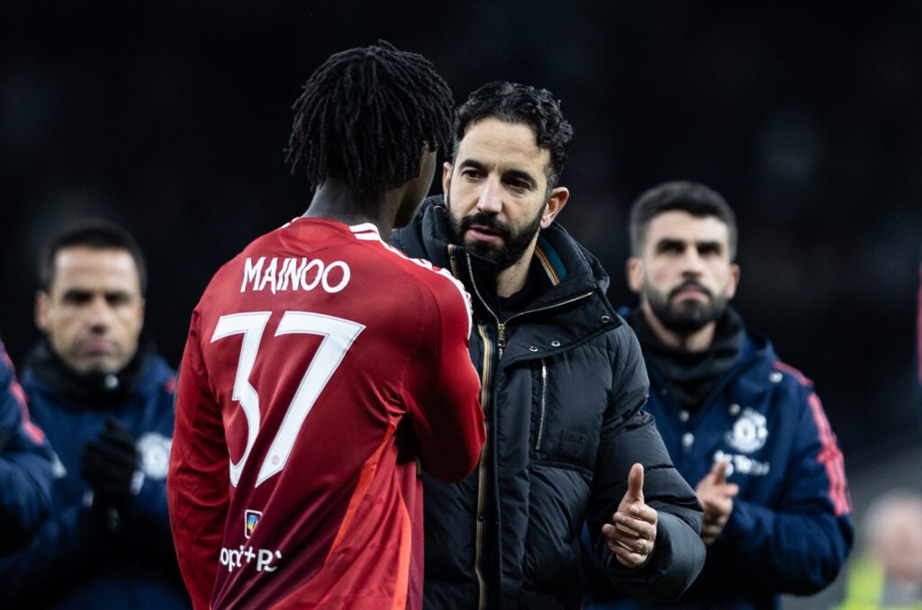 Manchester United's manager Ruben Amorim consoles Kobbie Mainoo at the end of the match during the Carabao Cup Quarter Final match between Tottenham Hotspur and Manchester United at Tottenham Hotspur Stadium on December 19, 2024