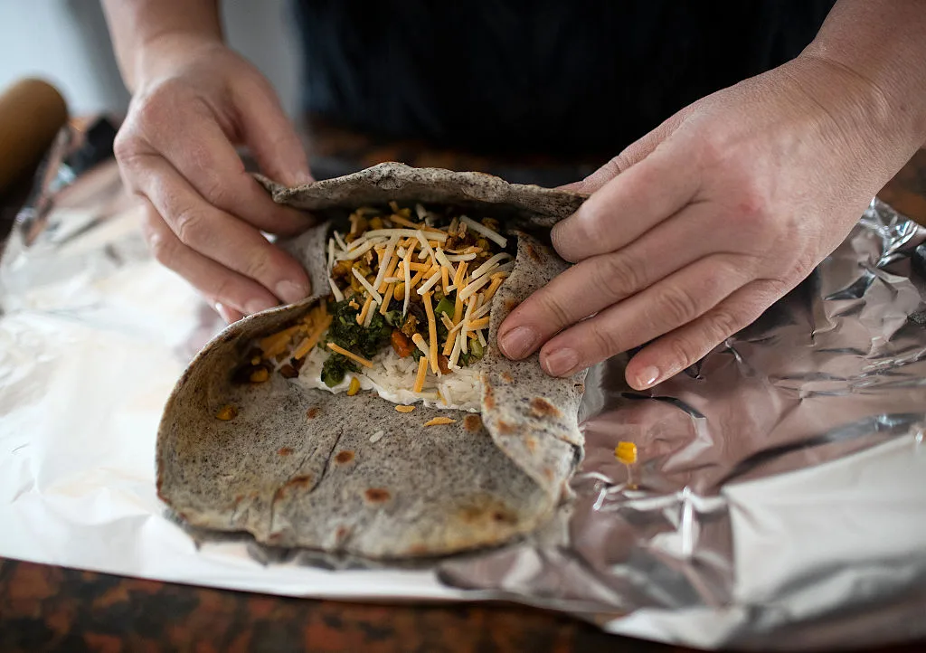 A burrito being wrapped 