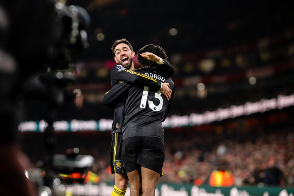 PATRICK DORGU embraced by Bruno Fernandes.