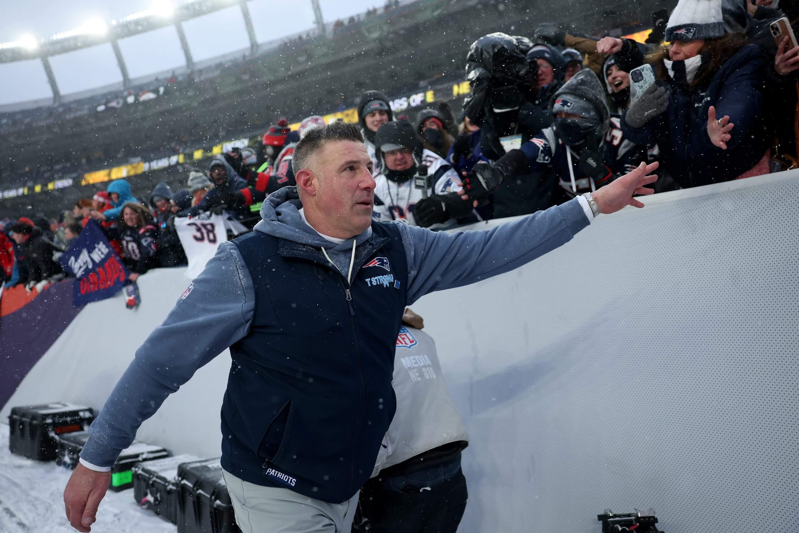 Head coach Mike Vrabel of the New England Patriots interacts with fans following the AFC Championship Playoff game against the Denver Broncos at Empower Field At Mile High on January 25, 2026 in Denver, Colorado.
