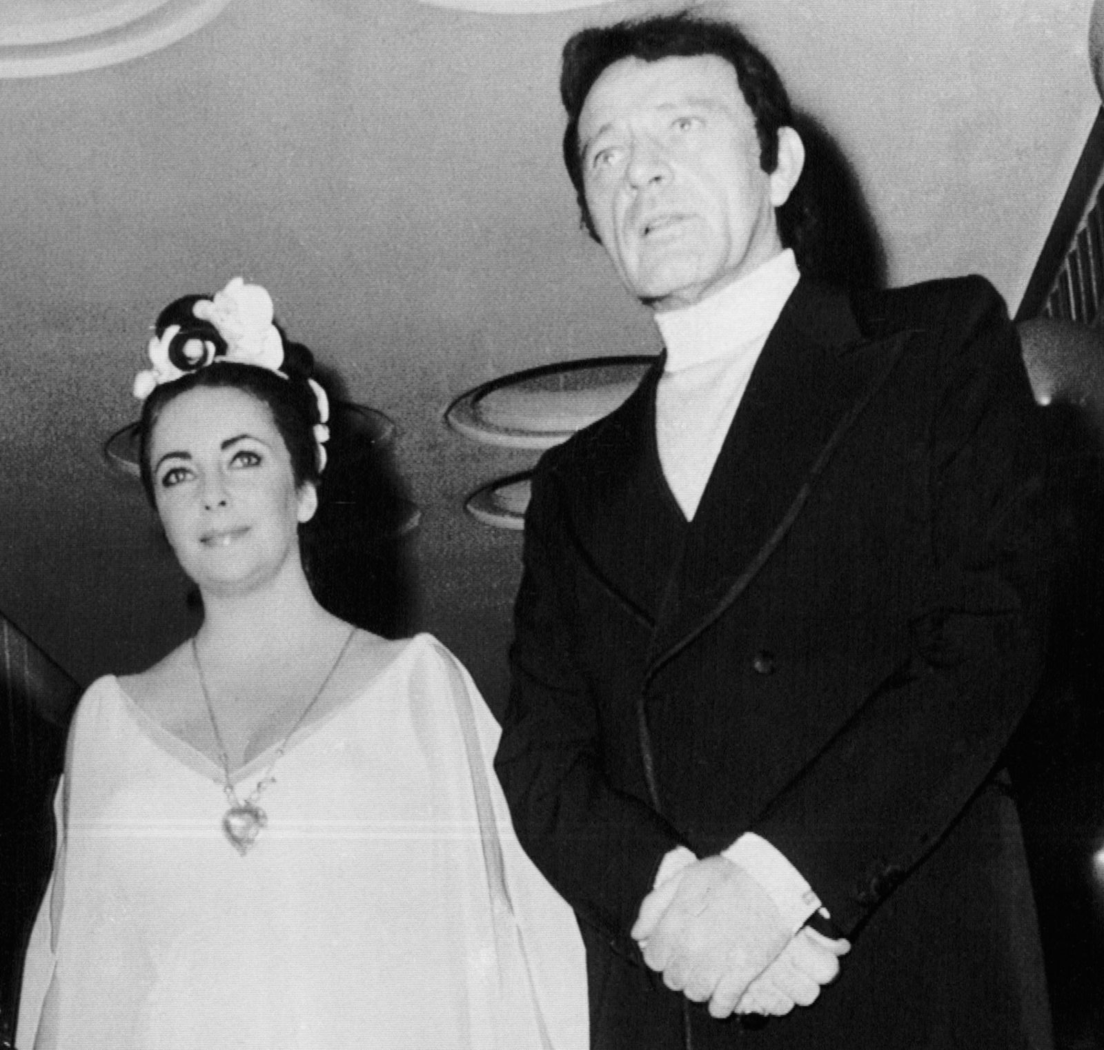 Image may contain Richard Burton Elizabeth Taylor Clothing Formal Wear Suit Accessories Jewelry Necklace and Adult