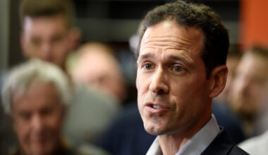 man speaks during press conferences