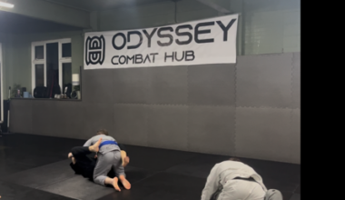 Fighters practice wrestling in Odyssey Combat Hub