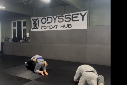Fighters practice wrestling in Odyssey Combat Hub