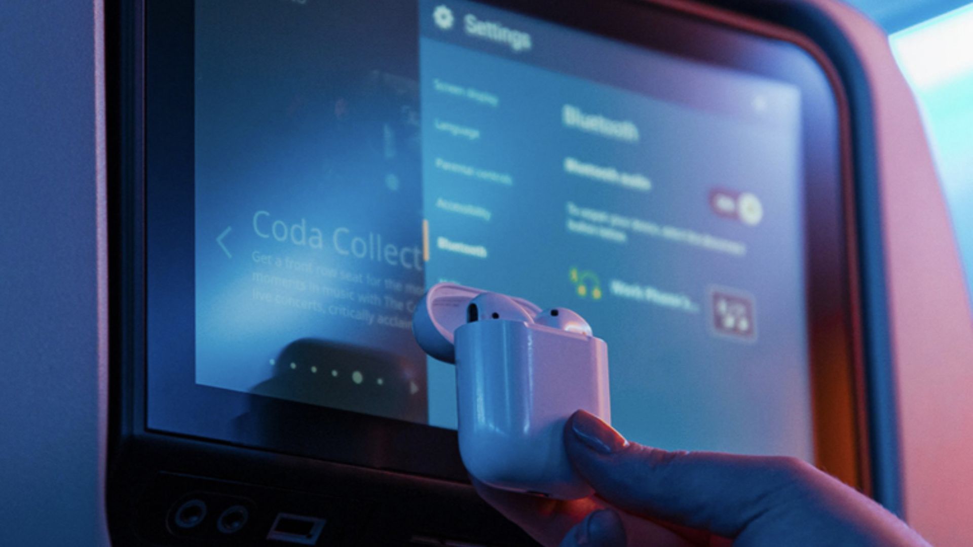 In-Flight-Entertainment-system-Bluetooth A photograph of Apple AirPods pairing with an in-flight entertainment system.