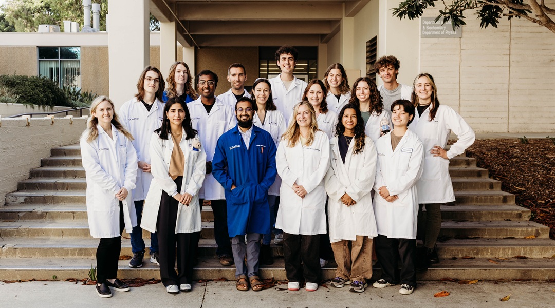 Group photo including Professor Alexis Komor