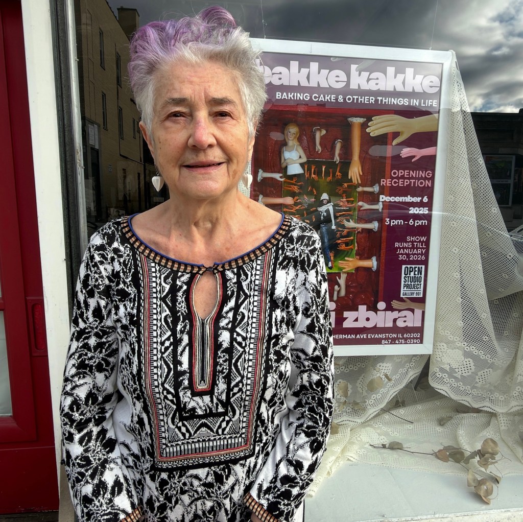 older woman in front of exhibit window