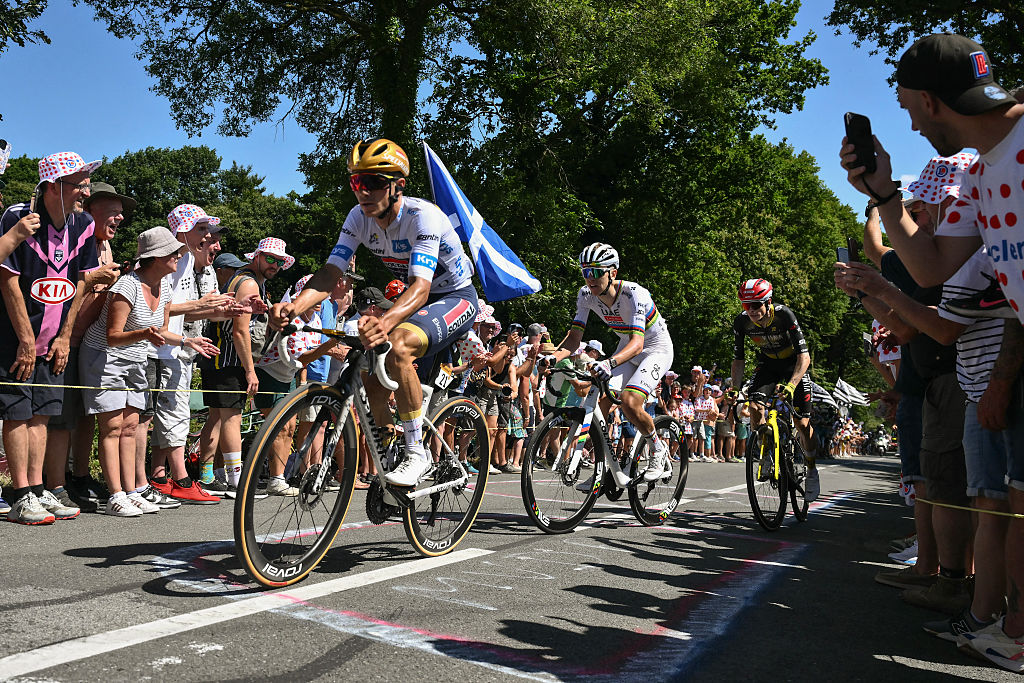 (From L) Soudal Quick-Step team's Belgian rider Remco Evenepoel, UAE Team Emirates - XRG team's Slovenian rider Tadej Pogacar and Team Visma - Lease a bike team's Danish rider Jonas Vingegaard cycle in the ascent of Mur-de-Bretagne in the final kilometres of the 7th stage of the 112th edition of the Tour de France cycling race, 197 km between Saint-Malo and Mur-de-Bretagne Guerledan, in Brittany, western France, on July 11, 2025. (Photo by Marco BERTORELLO / AFP)