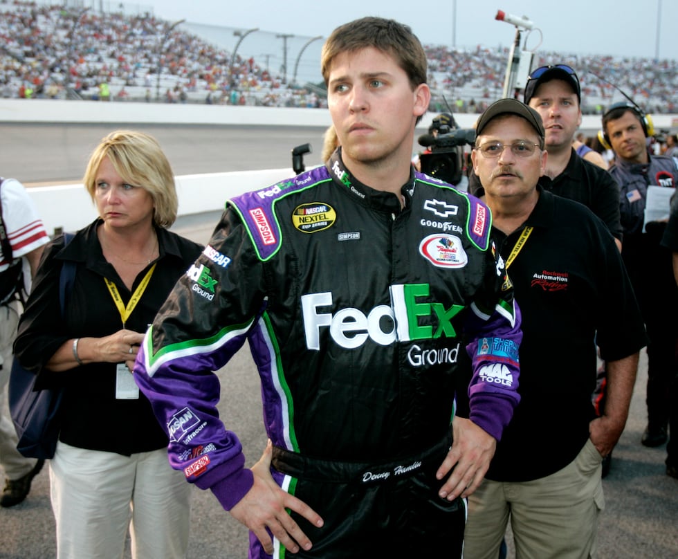 ** FILE ** Denny Hamlin, center, watches the competition with his mother, Mary Lou, left, and...