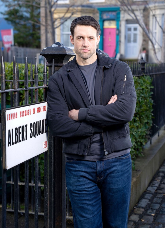 551592,TITLE:Eastenders Stephen Aaron-Sipple poses on the exterior Albert Square set in a promo photo as Mark Fowler Jr for EastEnders.