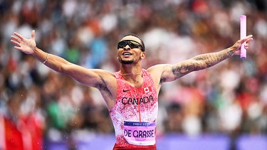 Andre De Grasse celebrates after winning the men's 4x100m relay at the Paris Games on Aug. 9, 2024.