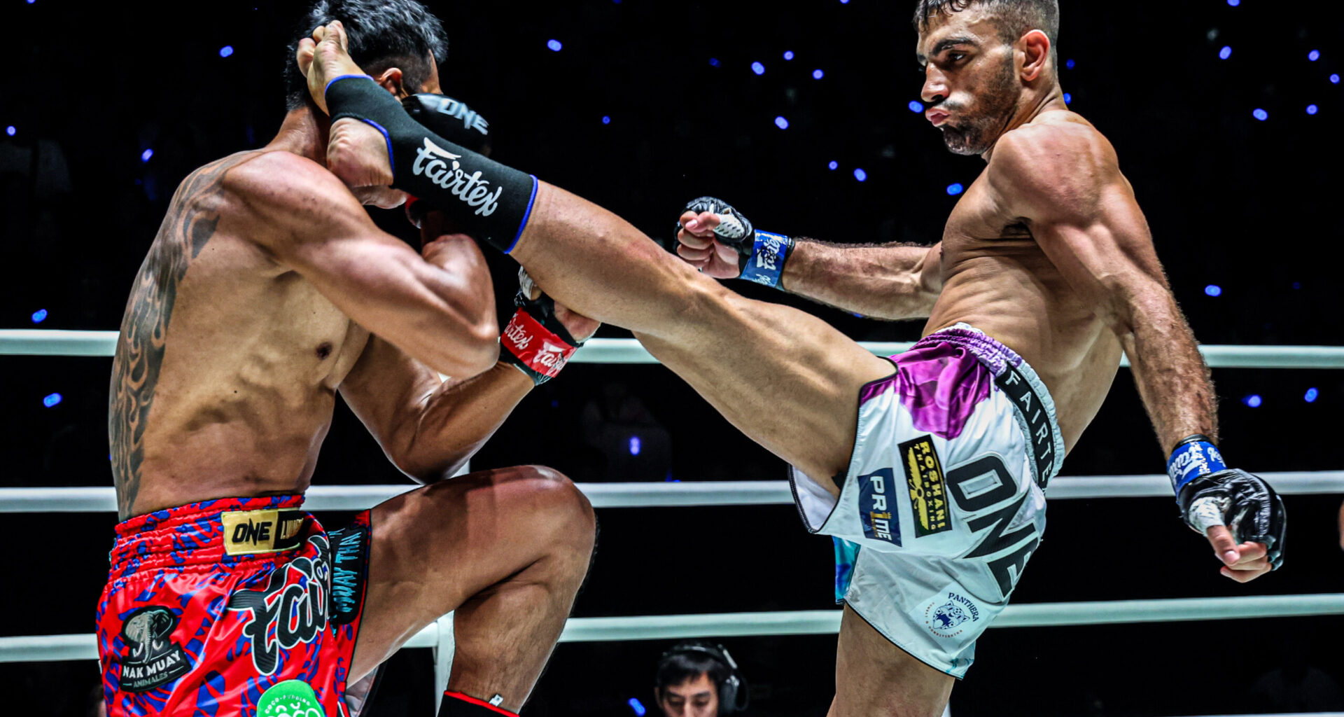 Iranian striker Mohammad Siasarani kicks "Smokin" Jo Nattawut