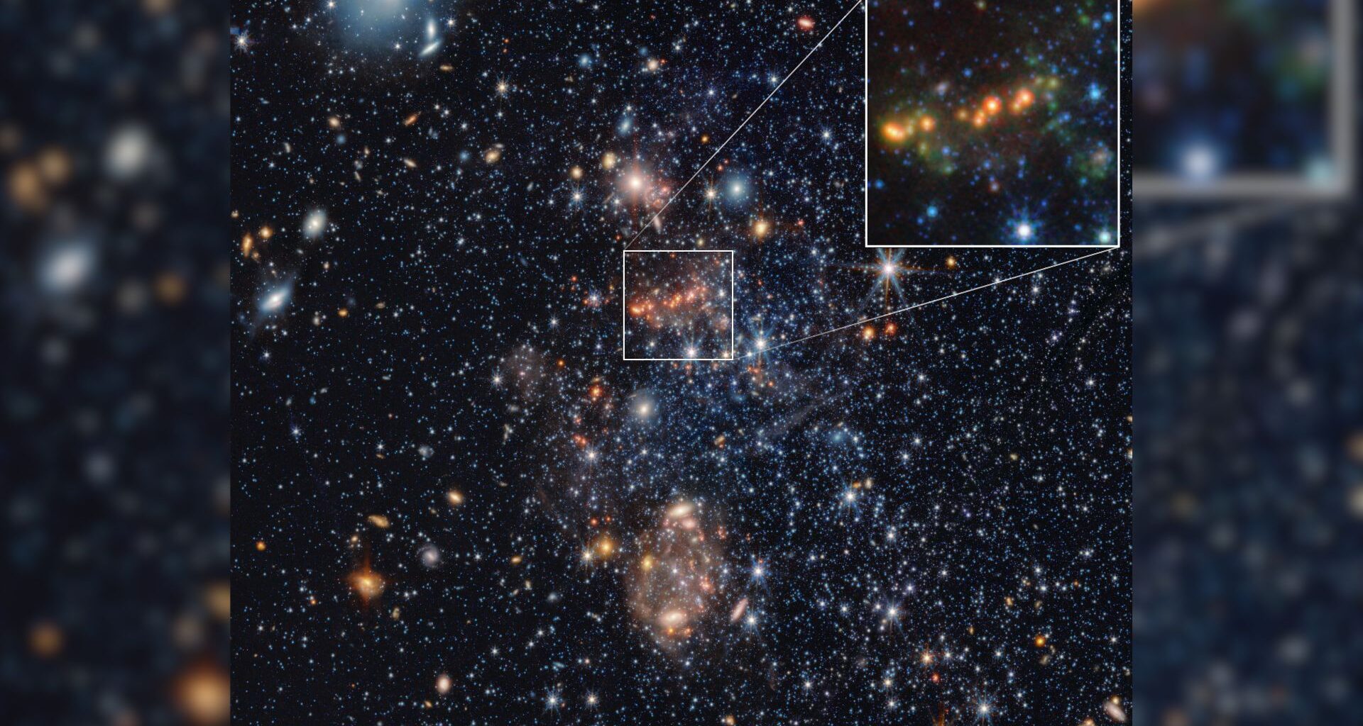 An image of blue and gold and white stars in deep space, with a boxout in the top right corner zooming in on a cluster of golden stars