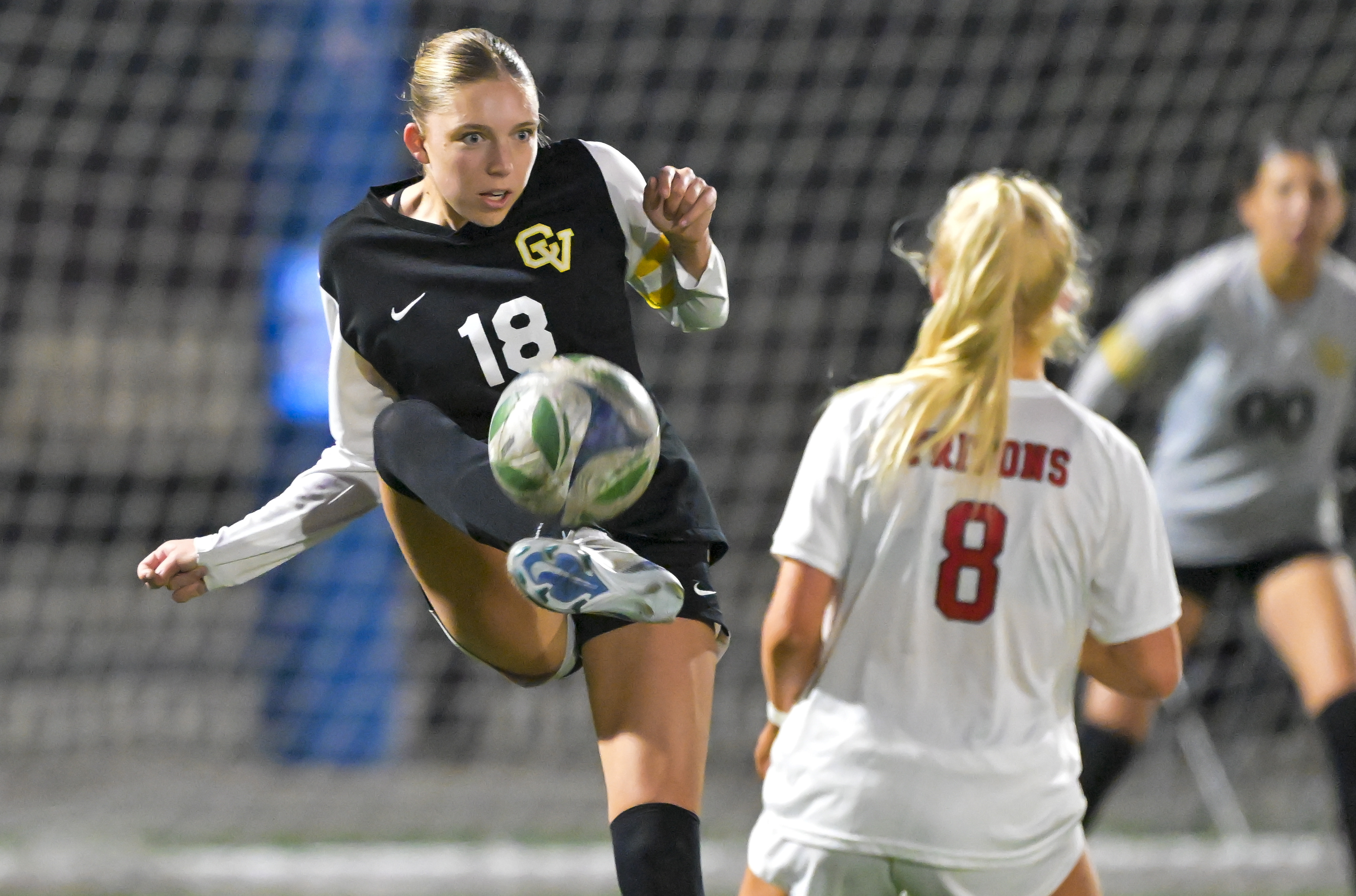 Harper Kleindienst (18) of Capistrano Valley kicks the ball past...