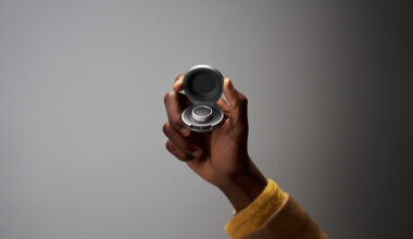 An Oura Ring user holds their Oura Ring Charging Case in hand.
