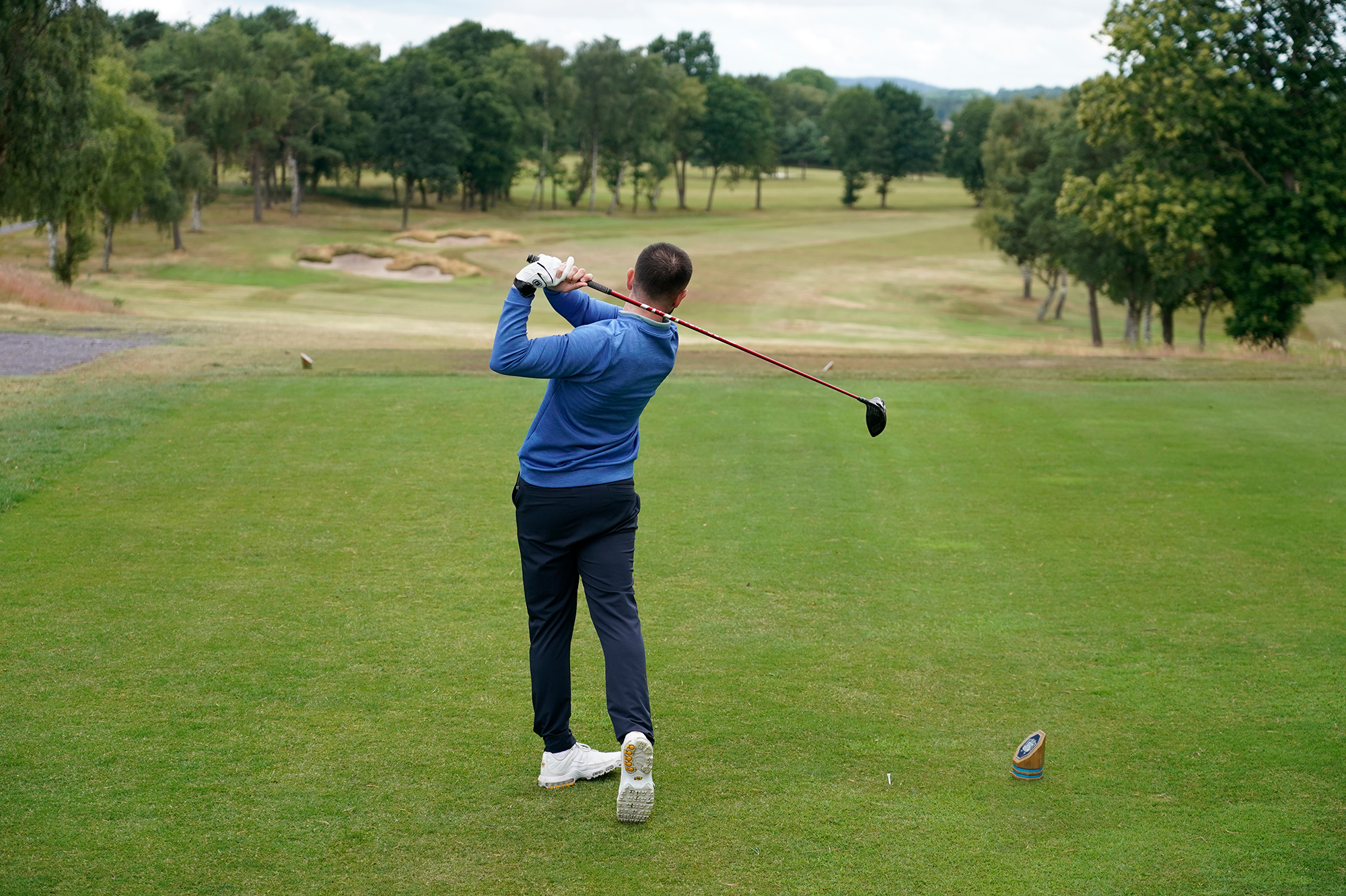 Baz Plummer in the finish position, from behind, after hitting driver off the tee