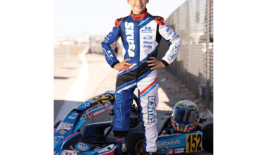 Pedro Cueto in front of his race car