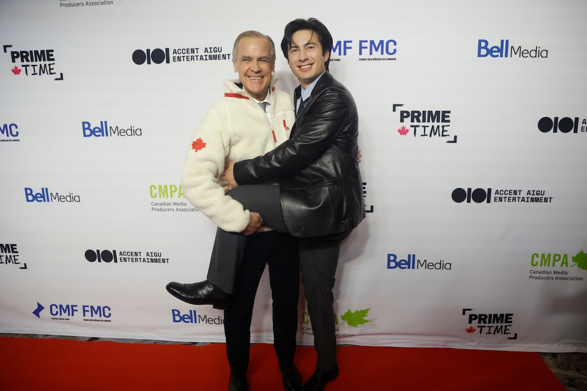 Heated Rivalry’s Hudson Williams and Mark Carney share a fleecy moment