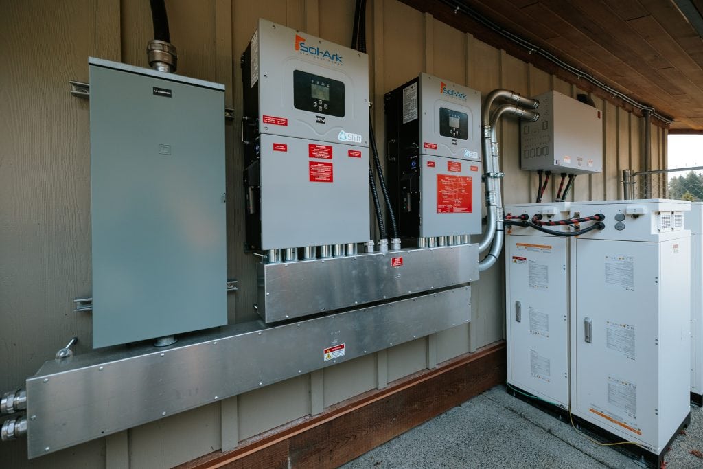 At Quatsino's daycare, silver machinery is mounted on a wall - solar power inverter equipment